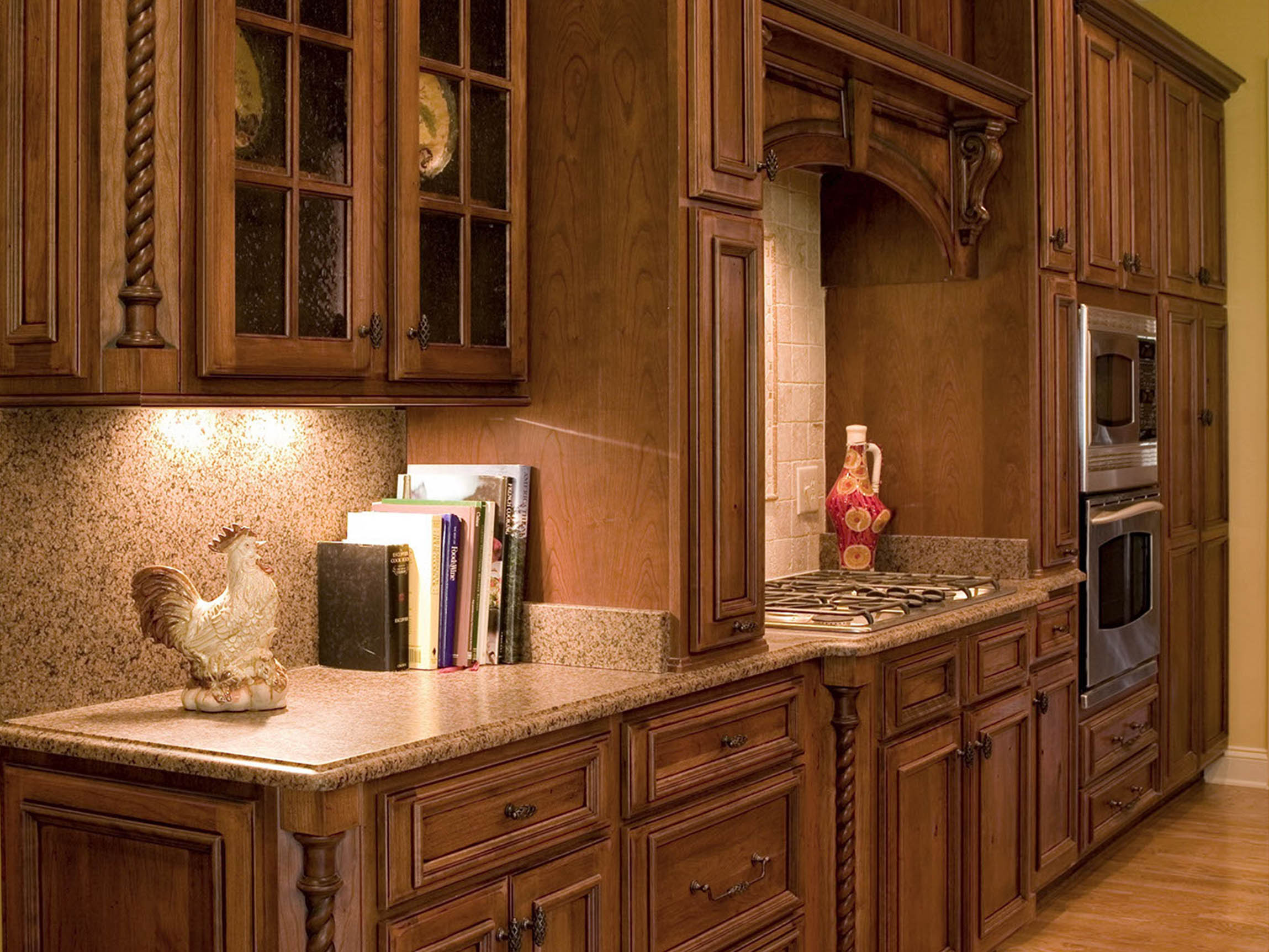 A kitchen with wooden cabinets.